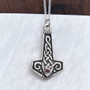 The Reithe Gem Hammer features knotwork and a 4mm gemstone. Shown with Amethyst.