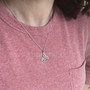 The Radanta Knot Pendant, shown for scale.