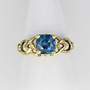14kt yellow gold knotwork ring with a 2.17ct Blue Zircon.