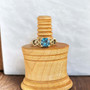 14kt yellow gold knotwork ring with a 2.17ct Blue Zircon.