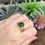 The Dain Gem Ring features grooved knotwork, beads and a 10x14 gemstone. Yellow gold with Green Tourmaline. Shown on size 7 finger.