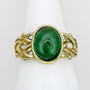 The Dain Gem Ring features grooved knotwork, beads and a 10x14 gemstone. Yellow gold with Green Tourmaline.