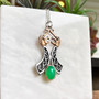 The Beithir Gem Pendant features two stylized serpent dragon heads with a 10x14mm gemstone at the bottom. Sterling & rose gold with Chrysoprase.