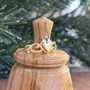 The Grá mo Chroí Claddagh Ring features a solid raised heart within a heart, a delicate crown and graceful open knotwork sides. Shown in yellow gold.