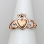 The Grá mo Chroí Claddagh Ring features a solid raised heart within a heart, a delicate crown and graceful open knotwork sides. Shown in rose gold.