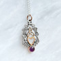 The Lannier Gem Pendant features thistles, leaves, a trinity knot, a heart and a 6mm gem. Pictured in sterling, rose gold and Amethyst.