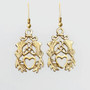 The Mìn Earrings features thistles, leaves, a trinity knot and a heart. Shown in yellow gold.