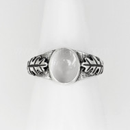 The Athrù Gem ring features an 8x10 gemstone with oak leaves and acorns on the sides. Shown with Moonstone.