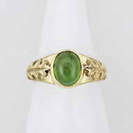 The Athrù Gem ring features an 8x10 gemstone with oak leaves and acorns on the sides. Shown in yellow gold with Green Tourmaline.
