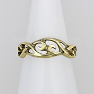 The Hawise Knot Ring features intertwined knotwork and curls. Shown in yellow gold.
