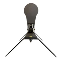 Outdoor range installation of Magnum Auto Popper anchored into ground with leg set, showing stable setup for high-energy centerfire rifle training sessions.