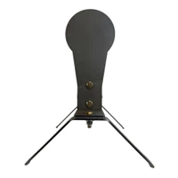 Lifestyle range scene with shooter running timed drills on auto-reset steel target system, practicing magnum rifle accuracy without walking downrange between shots.