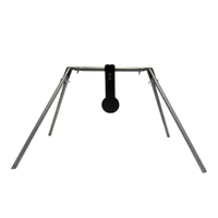 Installed steel spinner target mounted in outdoor rifle range setting, showing free-spinning plate system positioned for long-distance precision shooting practice