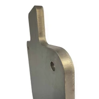Steel gong target installed on elevated chain mount system in open field range, positioned for safe 50 BMG long-distance rifle training.