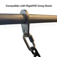 Outdoor shooting range setup with AR500 gong target installed using chain mounting kit on steel stand, positioned for long-distance rifle and handgun training.
