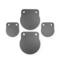 Set of AR500 steel gong targets displayed outdoors, featuring two small 4-inch plates and two larger 6-inch plates arranged for precision shooting practice.
