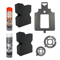 Close-up detail of steel target stencil edges showing cutout measurement guides and tab design used to prevent overspray during target painting.