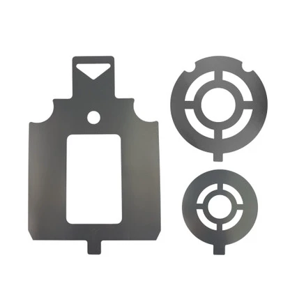 Aluminum target painting stencil held against steel shooting plate, applying clean circular aiming marks for consistent range training accuracy.