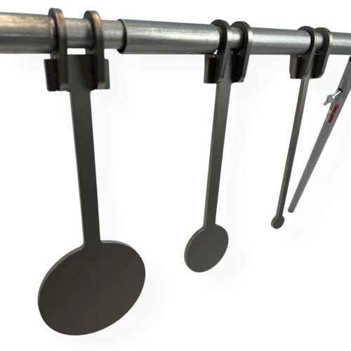 Rimfire KYL targets mounted on EMT crossbar in outdoor range setup, showing progressively sized steel plates arranged for accuracy training and precision shooting drills.
