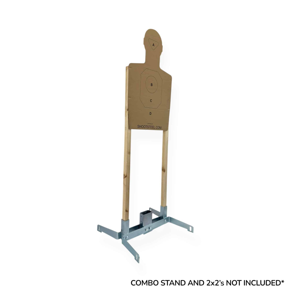 Cardboard training target mounted on stand at outdoor shooting range, used for pistol accuracy drills with visible A/B/C scoring zones for performance tracking.