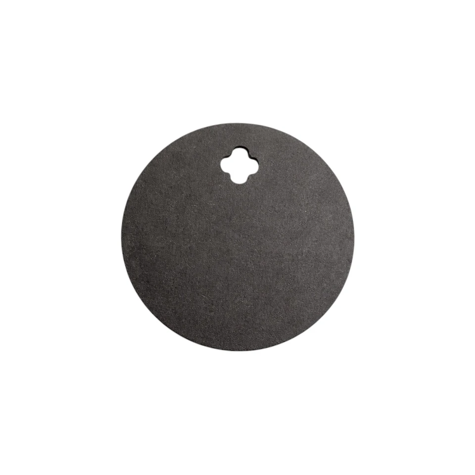 5 inch Steel round target absorbing rifle impact on outdoor range with visible ring reaction and minimal movement during centerfire shooting practice session
