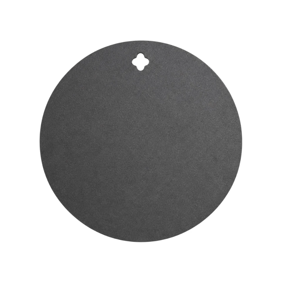 CNC laser-cut 3/8 inch AR500 12 inch steel round target mounted on range stand for pistol and carbine training at outdoor shooting range with clean strike surface