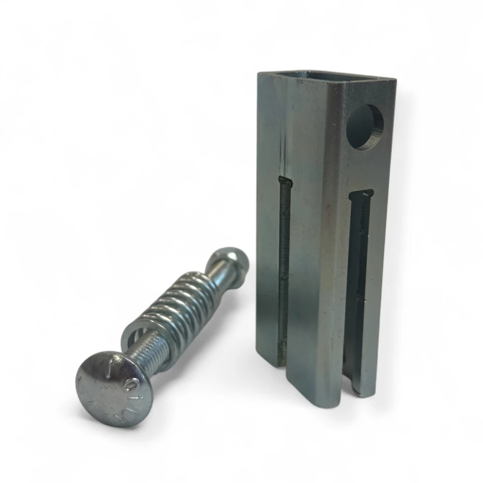 Close-up of CNC laser-cut AR500 steel target edge and T-post hanger attachment showing precise mounting holes and zinc-plated finish.