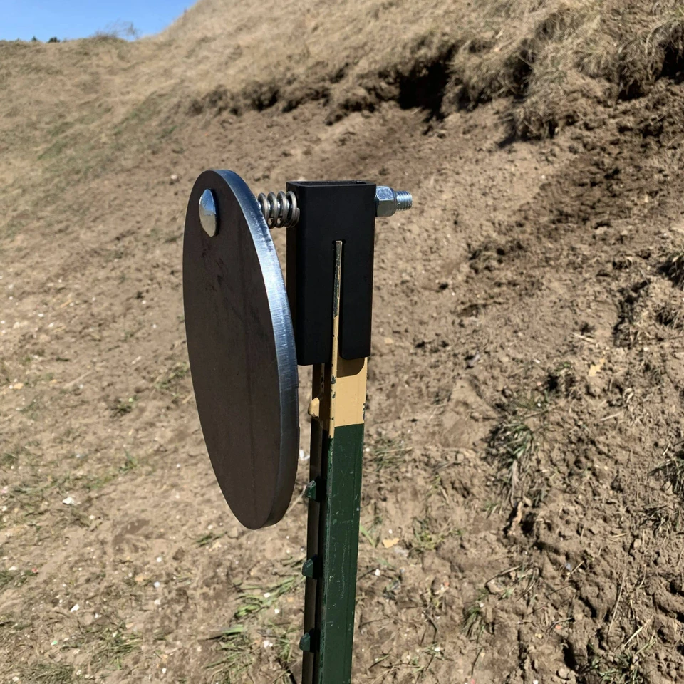 AR500 steel target surface showing impact marks and wear pattern after repeated shooting, highlighting durability of CNC laser-cut steel construction.