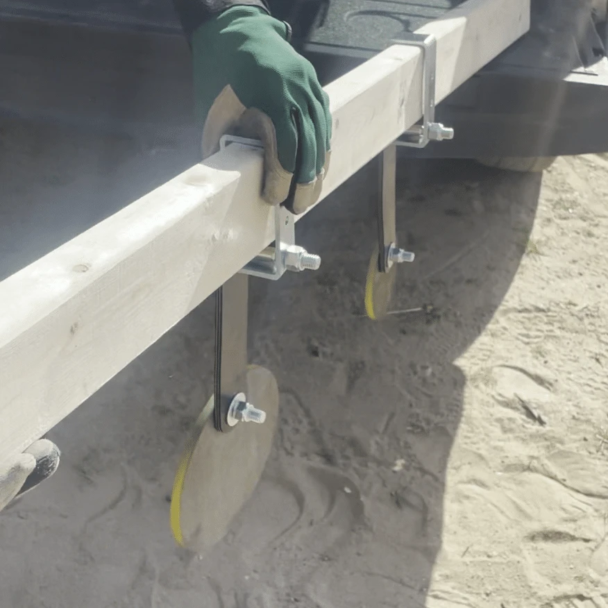 Close-up of rubber strap target hanger hardware attached to steel plate