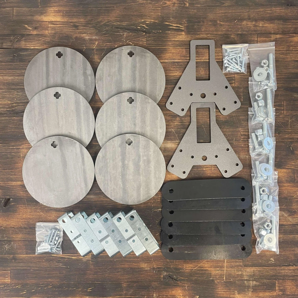Close-up detail of 1/2-inch AR500 steel target plate with laser-cut edge and mounting hole, showing durable construction and impact-resistant surface texture.