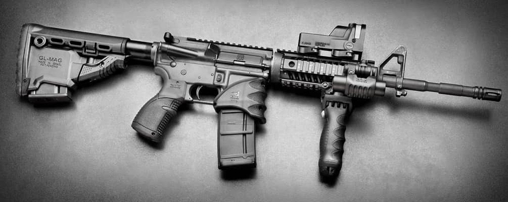 Home defense AR-15 with scope and attachments on side rail