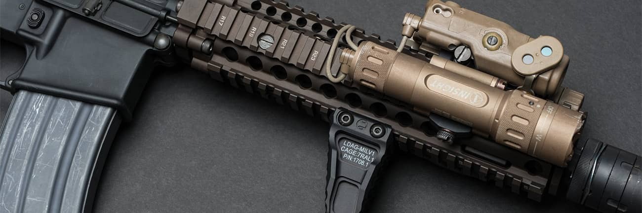 Home defense AR-15 side rail with attachments