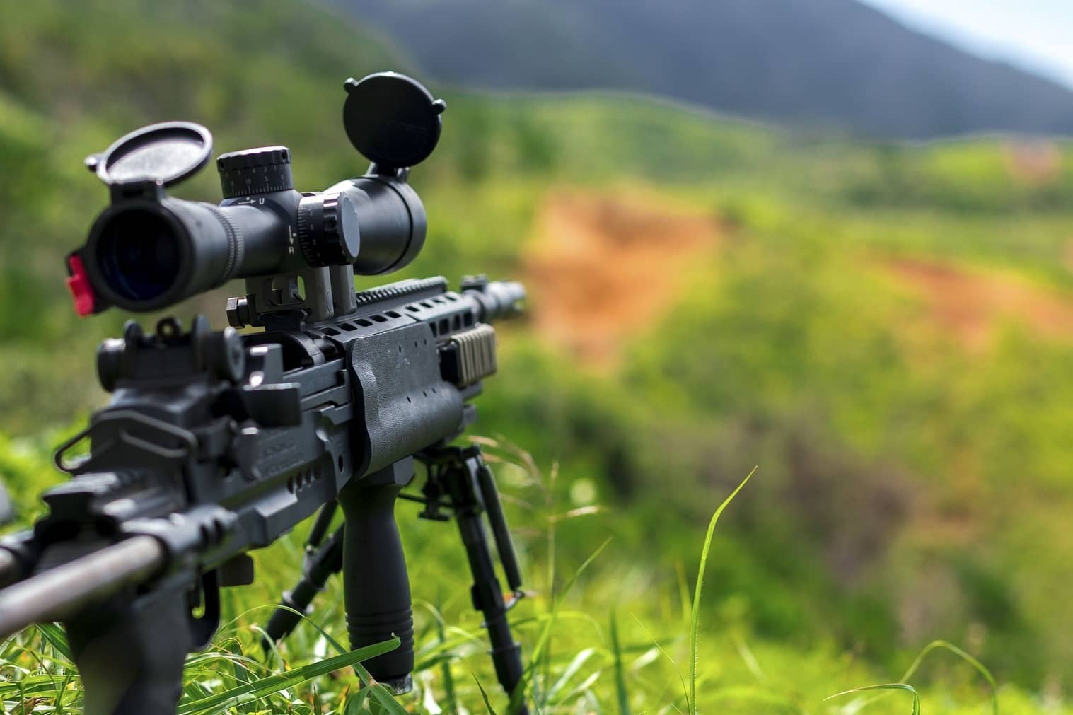 Custom rifle on a tripod in the field