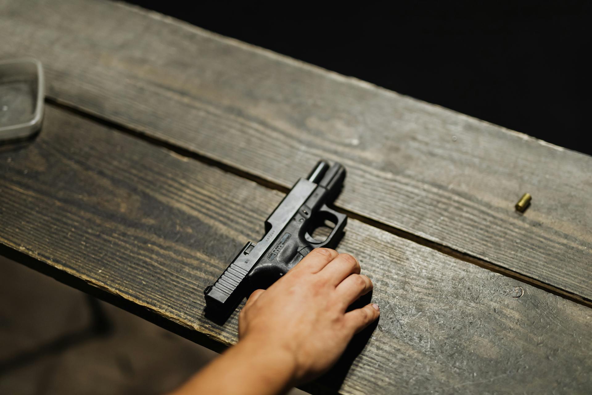 Pistol laying on table at gun range