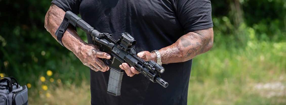 Picture of a person holding an AR pistol
