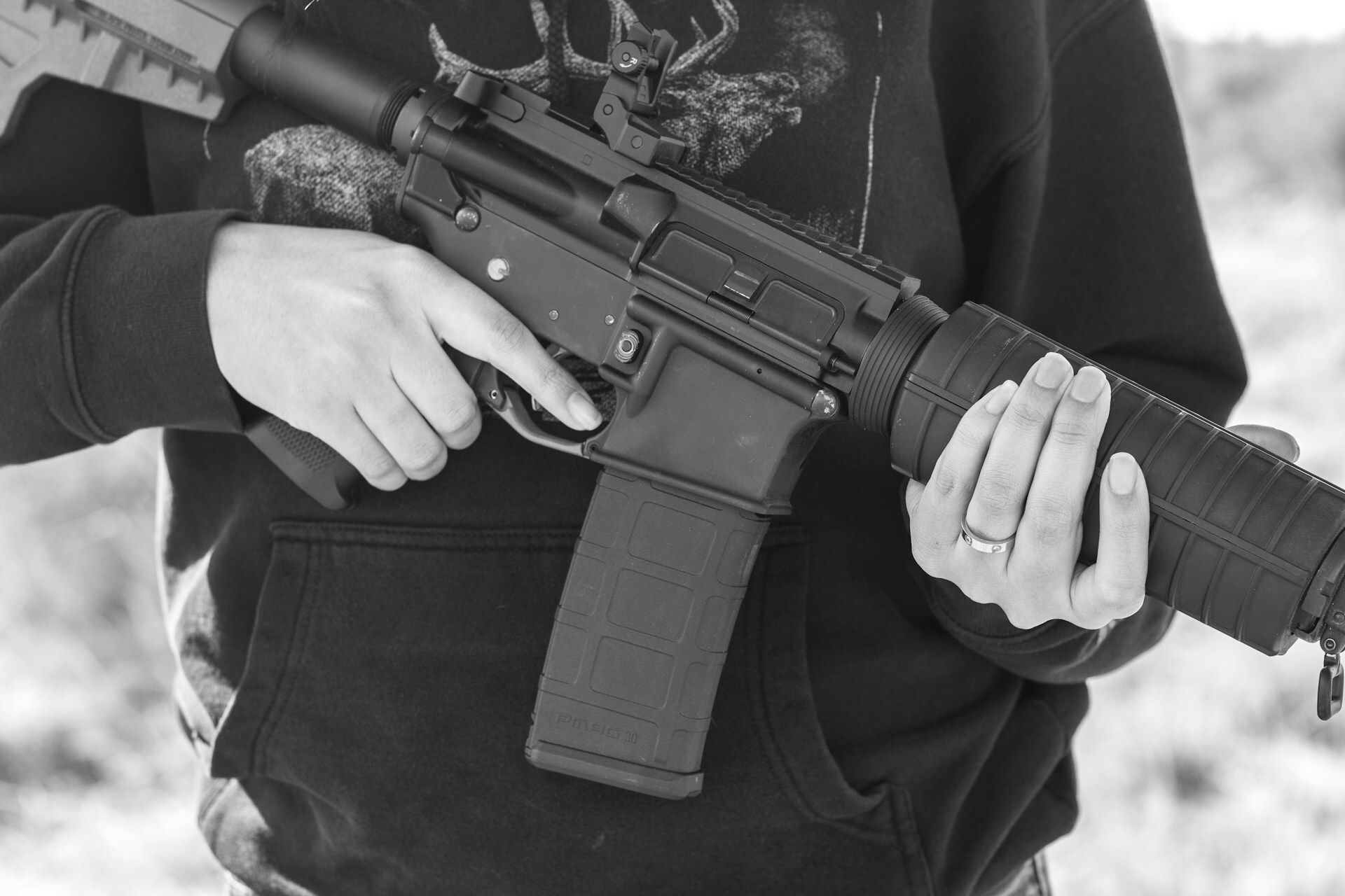 Man holding an AR-15 in his hands