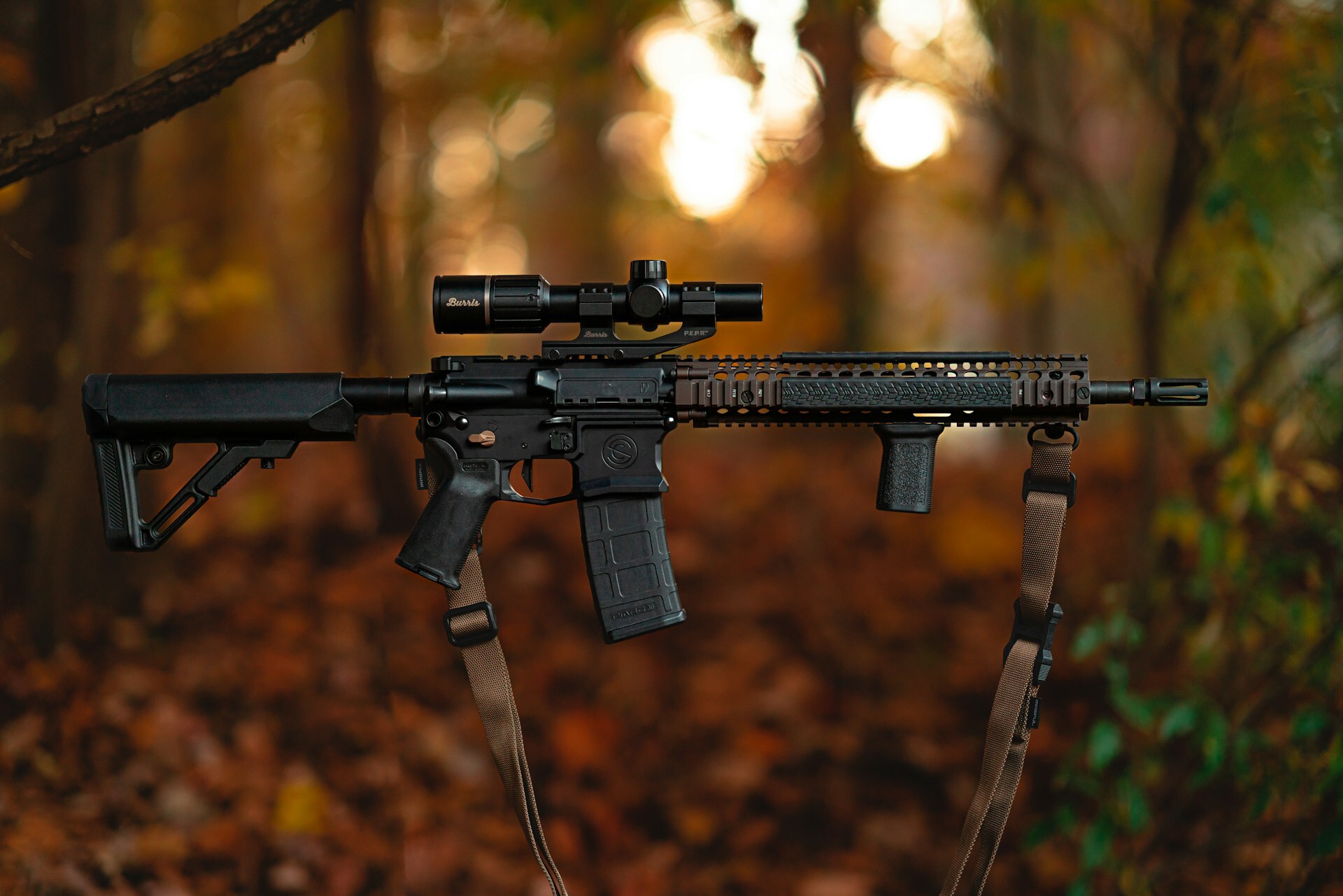 Rifle with scope in the woods