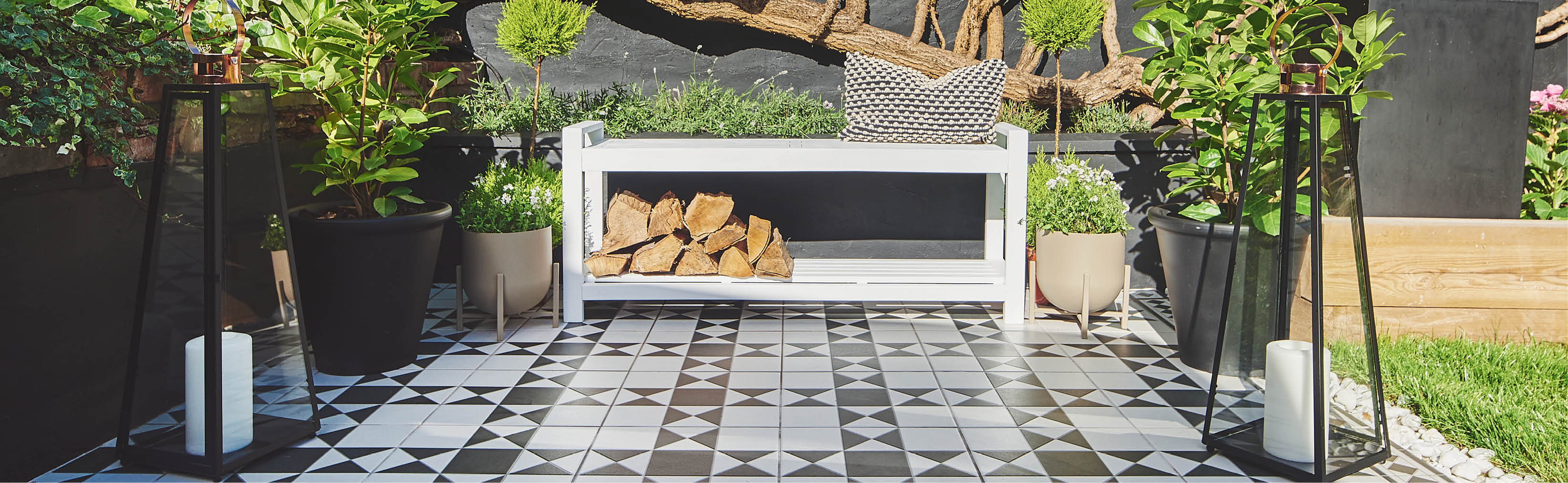 A white bench painted in the Rust-Oleum colour Cotton on black and white tiles