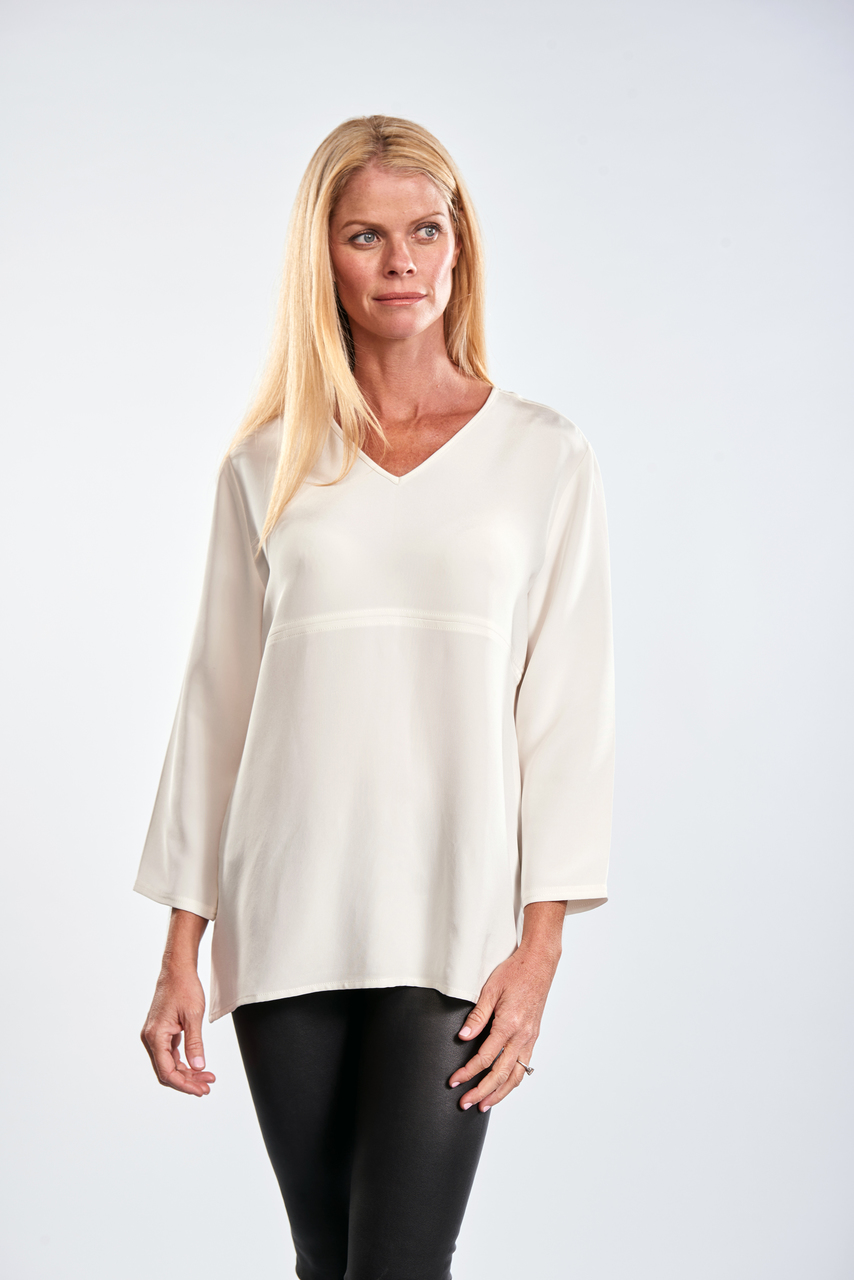 The Split Silk Tunic features a V-neck and three-quarter length sleeves. Lesli is wearing a size small. (She's 5' 8 1/2" tall.)