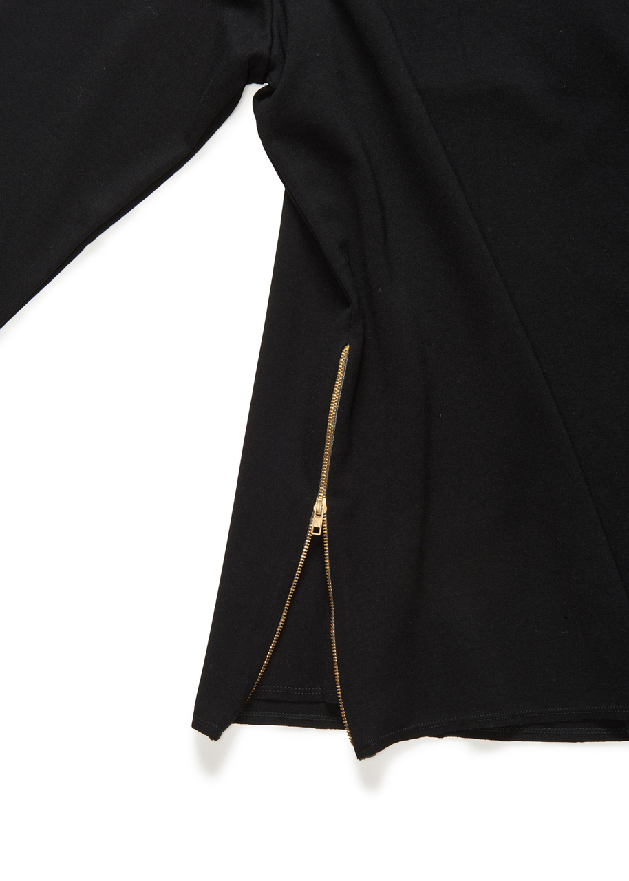 Open the 10-inch long gold zippers inserted on each side seam as wide as you like. No fear of bearing skin, there is a modesty panel that also acts to extend the wide of the bottom of this tunic when the zipper is completely unzipped.
