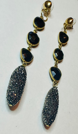 These onyx dangle earrings area. timeless and elegant choice for any occasion.  Onyx is a black gemstone know for its sleek and sophisticated appearance.  Theh dangle style adds movement and allure to the earrings, making them eye-catching and stylish.

The contrast between the dark onyx and the shine of the metal creates a striking and dramatic look.    Whether you're dressing up for a special event or adding a touch of sophistication to your everyday outfit, these earrings are versatile and will never go out of style.

Onyx is strength-giving.  It provides support in difficult or confusing circumstances and during times of enormous mental or physical stress.

County of Origin - Italy, Mexico, United States, Russia, Brazil, South Africa