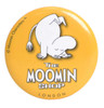 A round yellow button badge featuring a character from Moomin, with the text "The Moomin Shop" and a logo.