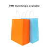 Two paper bags with twisted handles, one in orange and the other in blue, featuring logos.