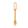 An orange USB light with a flexible design, featuring a USB connector at one end and a flat illumination area.