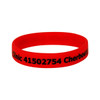 A red silicone wristband featuring black text and a logo.