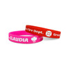 Two silicone wristbands, one pink and one red, featuring a logo and text.