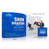 A fabric display wall featuring an S-shape, with a blue background and images of skiers. Includes a logo.
