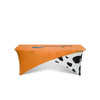 An orange and black cow-patterned 6ft stretch tablecloth with a logo.