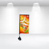A suction cup flag featuring vibrant orange and green graphics of refreshing beverages on a black stand.