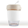 A reusable coffee cup featuring a clear glass base and a beige silicone band and lid. It has a straw.